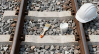 Painting The Sides Of Railroad Rails White To Reduce Derailment